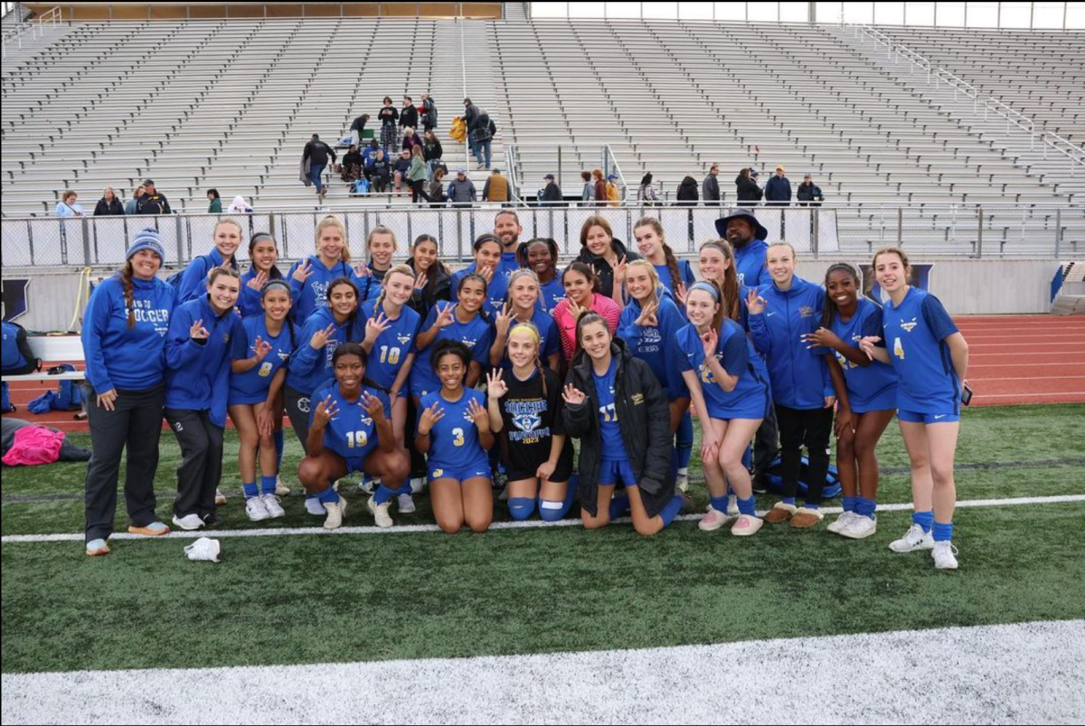 Girls Soccer team posing for a picture after winning area champions on March 29, 2023.